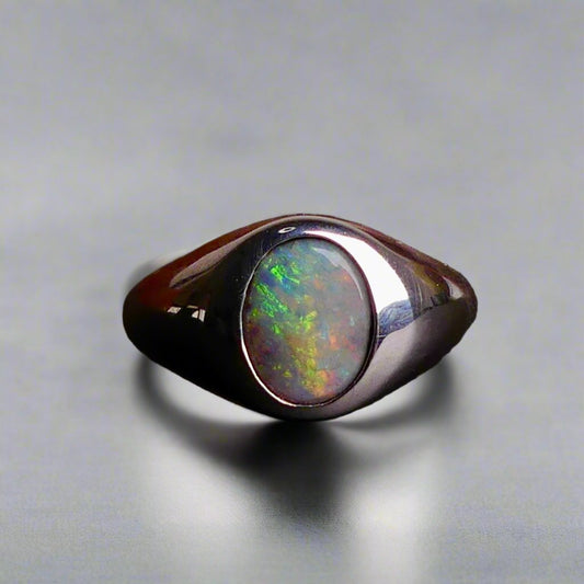 Expertly crafted with solid sterling silver and showcasing a beautiful and vibrant boulder opal, this ring is a stunning addition to any jewelry collection. The unique combination of metal and gemstone offers a timeless and elegant look, perfect for any occasion. Elevate your style with this exquisite piece

Opal Weight- 2ct

Setting- Sterling Silver Bezel Set

Size- 7us

Crafted By Australian Artisans