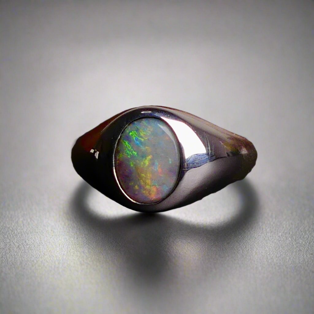 Expertly crafted with solid sterling silver and showcasing a beautiful and vibrant boulder opal, this ring is a stunning addition to any jewelry collection. The unique combination of metal and gemstone offers a timeless and elegant look, perfect for any occasion. Elevate your style with this exquisite piece

Opal Weight- 2ct

Setting- Sterling Silver Bezel Set

Size- 7us

Crafted By Australian Artisans