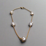 Expertly crafted with 9k gold and 5 Keshi pearls, our Elegant Keshi Pearl Bracelet exudes timeless sophistication. Each pearl's unique shape adds to the overall elegance of the piece, making it a perfect accessory for any occasion. Elevate your style with this exquisite bracelet.

Pearl- Keshi Saltwater Pearls

Setting- Handcrafted 9k Gold

Handcrafted By Australian Artisans