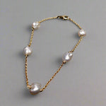 Expertly crafted with 9k gold and 5 Keshi pearls, our Elegant Keshi Pearl Bracelet exudes timeless sophistication. Each pearl's unique shape adds to the overall elegance of the piece, making it a perfect accessory for any occasion. Elevate your style with this exquisite bracelet.

Pearl- Keshi Saltwater Pearls

Setting- Handcrafted 9k Gold

Handcrafted By Australian Artisans