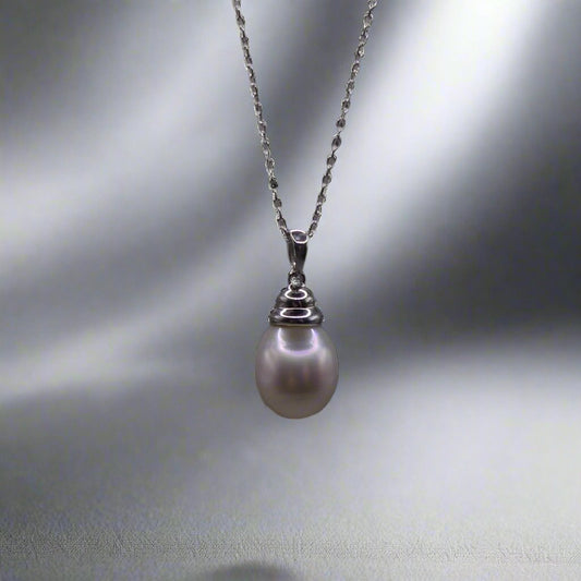 This beautiful sterling silver drop pearl pendant is the perfect addition to any jewelry collection. Made with high-quality materials, the elegant design exudes sophistication and grace. The lustrous South Sea pearl centerpiece adds a touch of luxury and can elevate any outfit. Enhance your style with this timeless accessory.

Pearl- South Sea Drop Pearl

Luster- AAA/AA

Size- 10mm

Setting- Sterling SIlver

Chain- Sterling Silver

Handcrafted By Australian Artisans