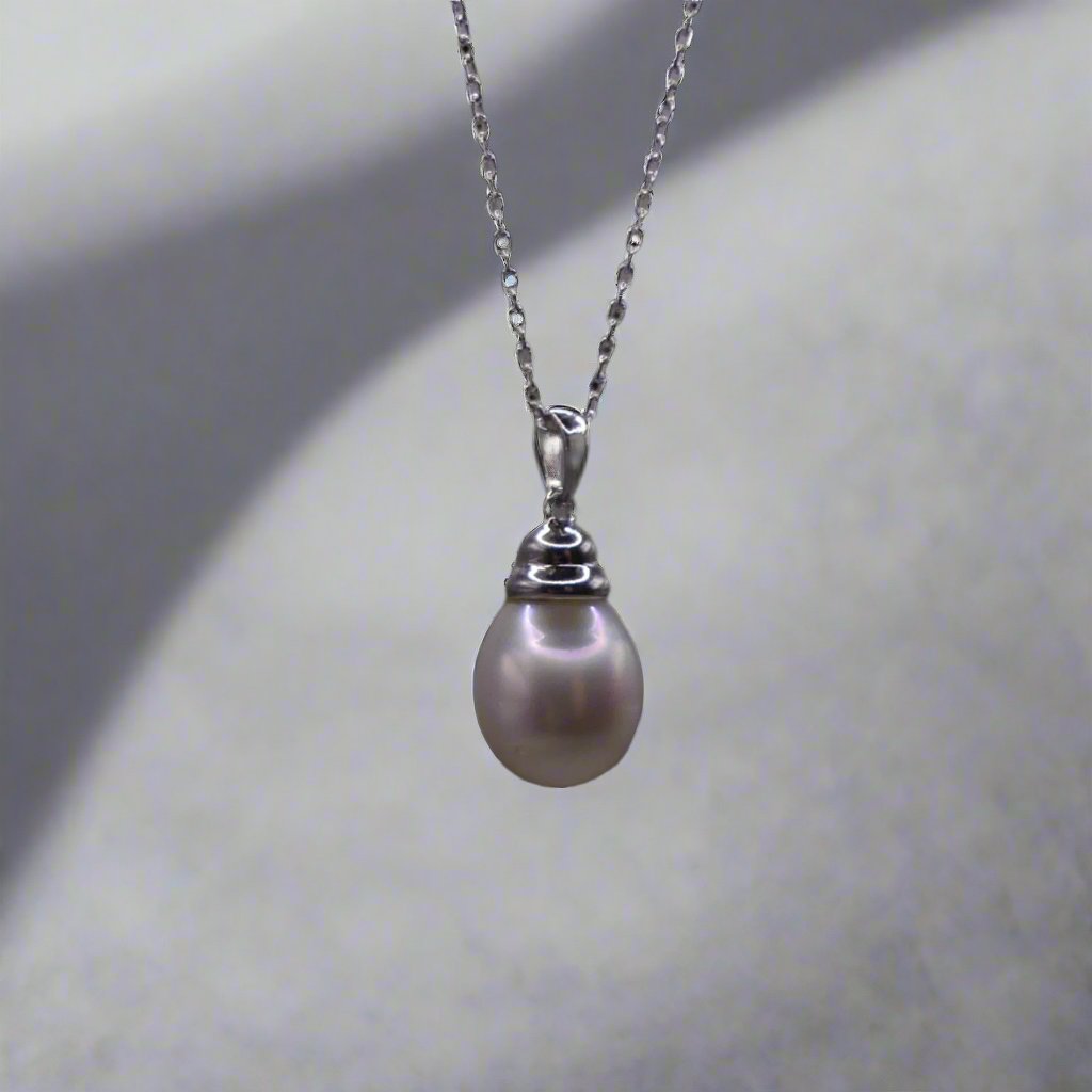 This beautiful sterling silver drop pearl pendant is the perfect addition to any jewelry collection. Made with high-quality materials, the elegant design exudes sophistication and grace. The lustrous South Sea pearl centerpiece adds a touch of luxury and can elevate any outfit. Enhance your style with this timeless accessory.

Pearl- South Sea Drop Pearl

Luster- AAA/AA

Size- 10mm

Setting- Sterling SIlver

Chain- Sterling Silver

Handcrafted By Australian Artisans