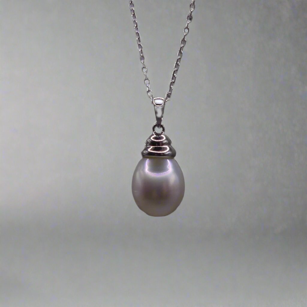 This beautiful sterling silver drop pearl pendant is the perfect addition to any jewelry collection. Made with high-quality materials, the elegant design exudes sophistication and grace. The lustrous South Sea pearl centerpiece adds a touch of luxury and can elevate any outfit. Enhance your style with this timeless accessory.

Pearl- South Sea Drop Pearl

Luster- AAA/AA

Size- 10mm

Setting- Sterling SIlver

Chain- Sterling Silver

Handcrafted By Australian Artisans