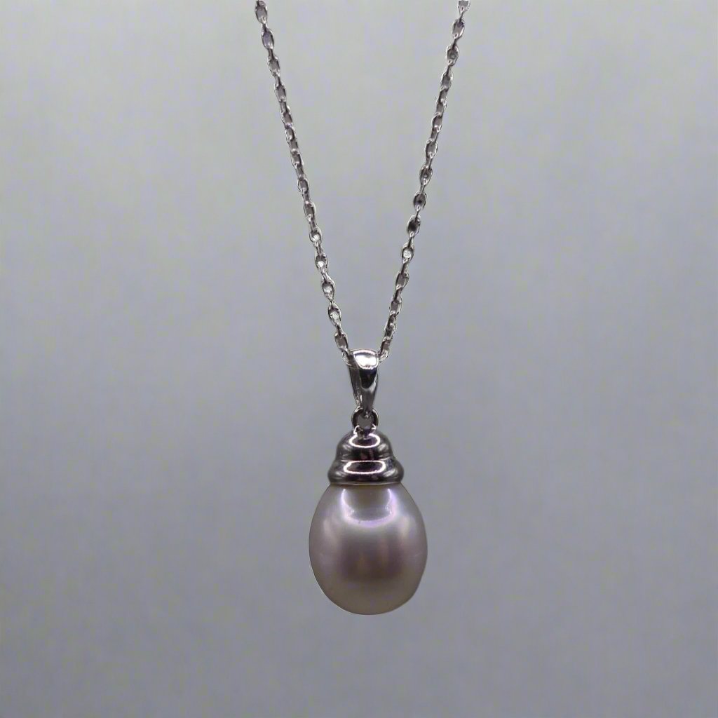 This beautiful sterling silver drop pearl pendant is the perfect addition to any jewelry collection. Made with high-quality materials, the elegant design exudes sophistication and grace. The lustrous South Sea pearl centerpiece adds a touch of luxury and can elevate any outfit. Enhance your style with this timeless accessory.

Pearl- South Sea Drop Pearl

Luster- AAA/AA

Size- 10mm

Setting- Sterling SIlver

Chain- Sterling Silver

Handcrafted By Australian Artisans