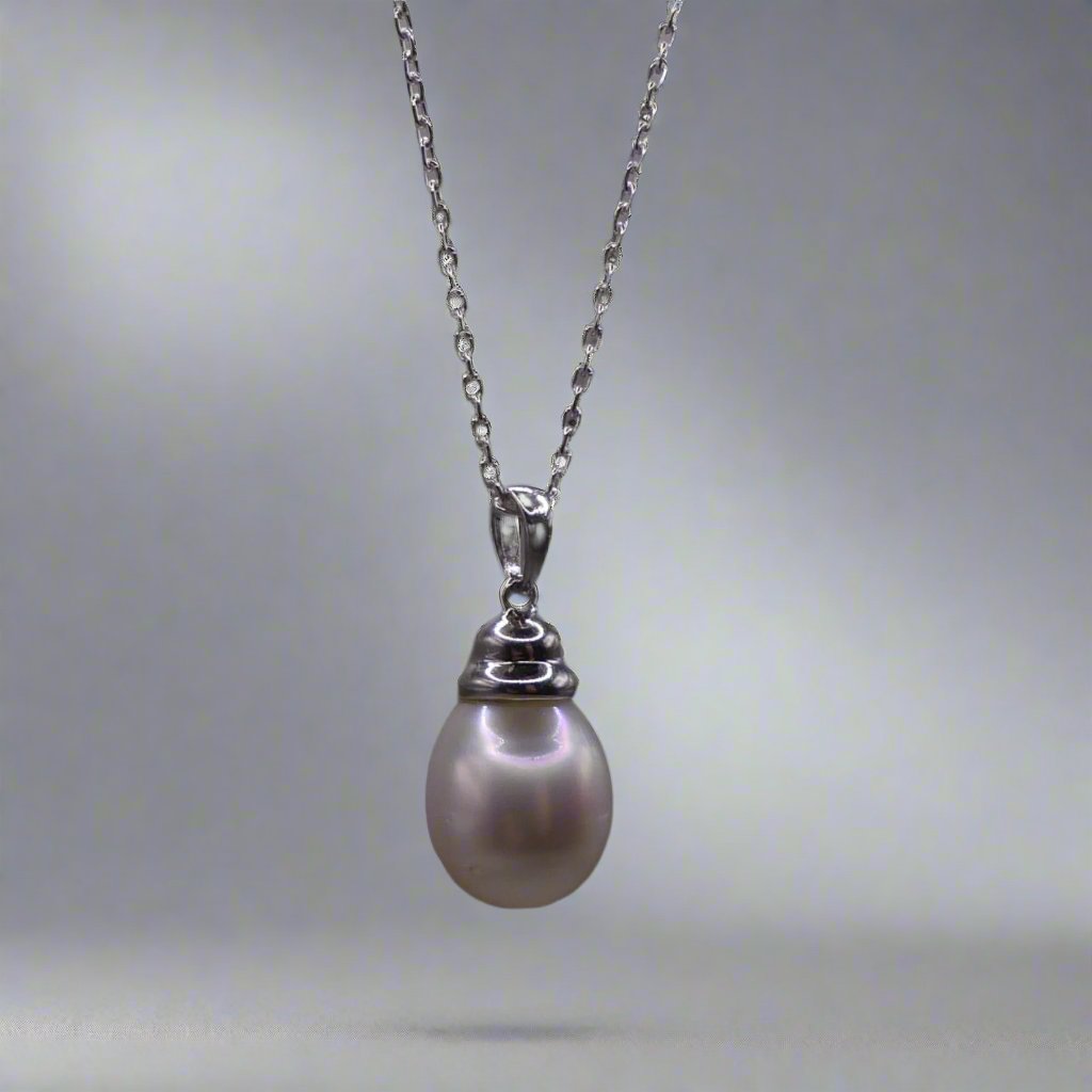 This beautiful sterling silver drop pearl pendant is the perfect addition to any jewelry collection. Made with high-quality materials, the elegant design exudes sophistication and grace. The lustrous South Sea pearl centerpiece adds a touch of luxury and can elevate any outfit. Enhance your style with this timeless accessory.

Pearl- South Sea Drop Pearl

Luster- AAA/AA

Size- 10mm

Setting- Sterling SIlver

Chain- Sterling Silver

Handcrafted By Australian Artisans