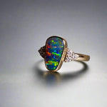 Expertly crafted, this stunning ring features a rare Australian gem boulder opal set in 14k gold and adorned with sparkling diamonds. The unique combination of precious materials and meticulous design makes this ring a one-of-a-kind piece, perfect for any special occasion or as a luxurious addition to any jewelry collection.

Origin- Queensland Australia

Opal Weight- 2.2ct Gem Australian Boulder Opal

Accent Stones- Natural Diamonds

Setting- 14K Gold Bezel Set

Size- 7 1/2 us
