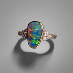 Expertly crafted, this stunning ring features a rare Australian gem boulder opal set in 14k gold and adorned with sparkling diamonds. The unique combination of precious materials and meticulous design makes this ring a one-of-a-kind piece, perfect for any special occasion or as a luxurious addition to any jewelry collection.

Origin- Queensland Australia

Opal Weight- 2.2ct Gem Australian Boulder Opal

Accent Stones- Natural Diamonds

Setting- 14K Gold Bezel Set

Size- 7 1/2 us
