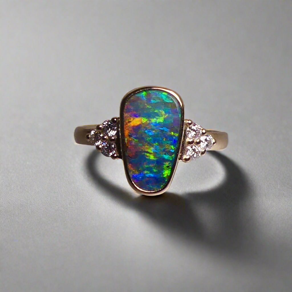 Expertly crafted, this stunning ring features a rare Australian gem boulder opal set in 14k gold and adorned with sparkling diamonds. The unique combination of precious materials and meticulous design makes this ring a one-of-a-kind piece, perfect for any special occasion or as a luxurious addition to any jewelry collection.

Origin- Queensland Australia

Opal Weight- 2.2ct Gem Australian Boulder Opal

Accent Stones- Natural Diamonds

Setting- 14K Gold Bezel Set

Size- 7 1/2 us

