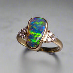 Expertly crafted, this stunning ring features a rare Australian gem boulder opal set in 14k gold and adorned with sparkling diamonds. The unique combination of precious materials and meticulous design makes this ring a one-of-a-kind piece, perfect for any special occasion or as a luxurious addition to any jewelry collection.

Origin- Queensland Australia

Opal Weight- 2.2ct Gem Australian Boulder Opal

Accent Stones- Natural Diamonds

Setting- 14K Gold Bezel Set

Size- 7 1/2 us
