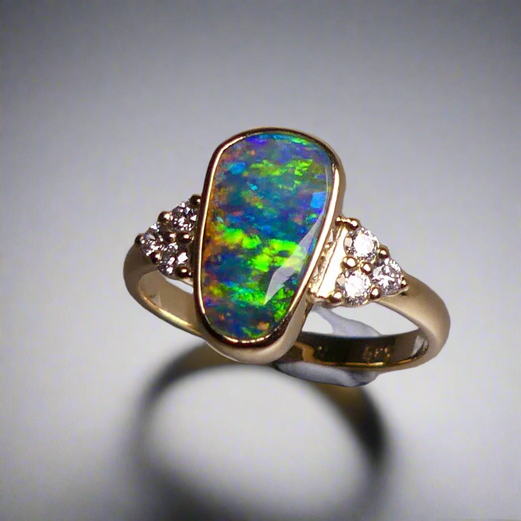 Expertly crafted, this stunning ring features a rare Australian gem boulder opal set in 14k gold and adorned with sparkling diamonds. The unique combination of precious materials and meticulous design makes this ring a one-of-a-kind piece, perfect for any special occasion or as a luxurious addition to any jewelry collection.

Origin- Queensland Australia

Opal Weight- 2.2ct Gem Australian Boulder Opal

Accent Stones- Natural Diamonds

Setting- 14K Gold Bezel Set

Size- 7 1/2 us
