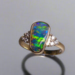 Expertly crafted, this stunning ring features a rare Australian gem boulder opal set in 14k gold and adorned with sparkling diamonds. The unique combination of precious materials and meticulous design makes this ring a one-of-a-kind piece, perfect for any special occasion or as a luxurious addition to any jewelry collection.

Origin- Queensland Australia

Opal Weight- 2.2ct Gem Australian Boulder Opal

Accent Stones- Natural Diamonds

Setting- 14K Gold Bezel Set

Size- 7 1/2 us
