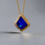 Expertly crafted, this Beautiful Australian Boulder Opal 18k Gold Pendant is a stunning piece of jewelry. Featuring a mesmerizing display of ocean blues and greens, this pendant is complemented by a solid 18k gold chain. Elevate any outfit with this unique and luxurious accessory.

Setting- 18k Gold bezel set

Opal Weight- 4.9ct

Origin- Queensland Australia

Chain- 18k gold cable chan, 45cm in Length

Expertly Handcrafted By Australian Artisans
