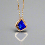 Expertly crafted, this Beautiful Australian Boulder Opal 18k Gold Pendant is a stunning piece of jewelry. Featuring a mesmerizing display of ocean blues and greens, this pendant is complemented by a solid 18k gold chain. Elevate any outfit with this unique and luxurious accessory.

Setting- 18k Gold bezel set

Opal Weight- 4.9ct

Origin- Queensland Australia

Chain- 18k gold cable chan, 45cm in Length

Expertly Handcrafted By Australian Artisans
