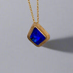 Expertly crafted, this Beautiful Australian Boulder Opal 18k Gold Pendant is a stunning piece of jewelry. Featuring a mesmerizing display of ocean blues and greens, this pendant is complemented by a solid 18k gold chain. Elevate any outfit with this unique and luxurious accessory.

Setting- 18k Gold bezel set

Opal Weight- 4.9ct

Origin- Queensland Australia

Chain- 18k gold cable chan, 45cm in Length

Expertly Handcrafted By Australian Artisans
