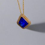 Expertly crafted, this Beautiful Australian Boulder Opal 18k Gold Pendant is a stunning piece of jewelry. Featuring a mesmerizing display of ocean blues and greens, this pendant is complemented by a solid 18k gold chain. Elevate any outfit with this unique and luxurious accessory.

Setting- 18k Gold bezel set

Opal Weight- 4.9ct

Origin- Queensland Australia

Chain- 18k gold cable chan, 45cm in Length

Expertly Handcrafted By Australian Artisans
