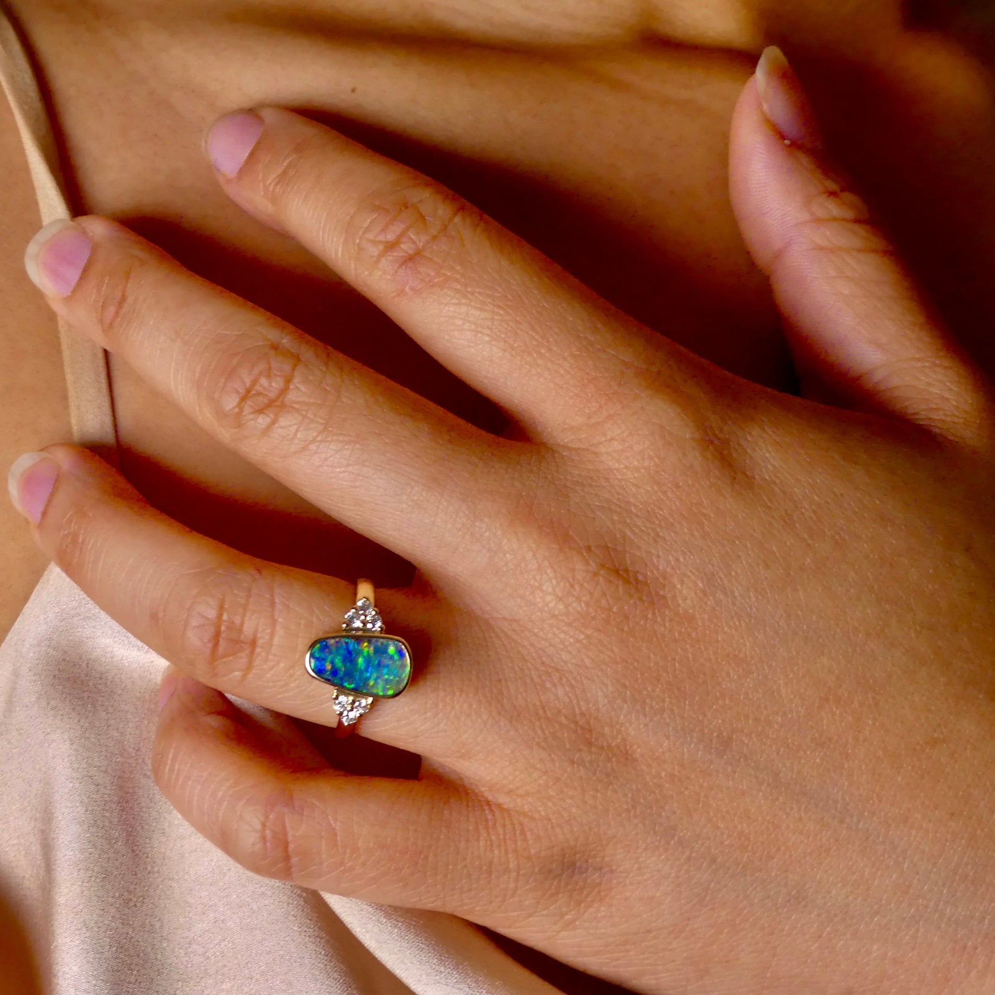 Expertly crafted, this stunning ring features a rare Australian gem boulder opal set in 14k gold and adorned with sparkling diamonds. The unique combination of precious materials and meticulous design makes this ring a one-of-a-kind piece, perfect for any special occasion or as a luxurious addition to any jewelry collection.

Origin- Queensland Australia

Opal Weight- 2.2ct Gem Australian Boulder Opal

Accent Stones- Natural Diamonds

Setting- 14K Gold Bezel Set

Size- 7 1/2 us
