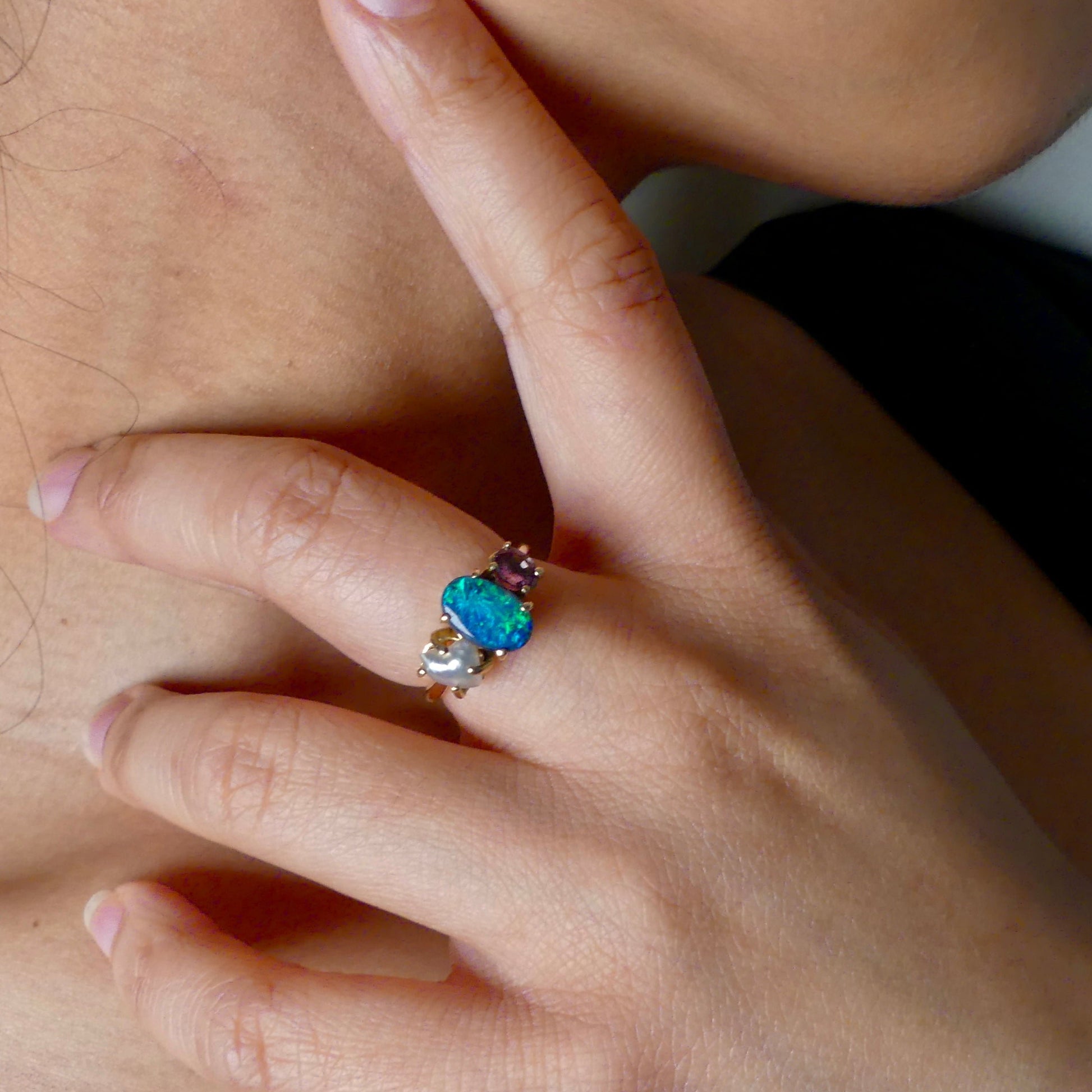 Experience the stunning harmony of nature with our 14k gold Australian Black Opal ring from our Seascapes Collection.

Origin- Lightning Ridge Australia

Opal Weight- 1ct Australian Black Opal

Accent Stone - Mauve Tourmaline

Pearl- Keshi pearl

Setting- 14k gold claw

Ring Size - 6 1/2 us

Handcrafted and designed by Australian Artisians