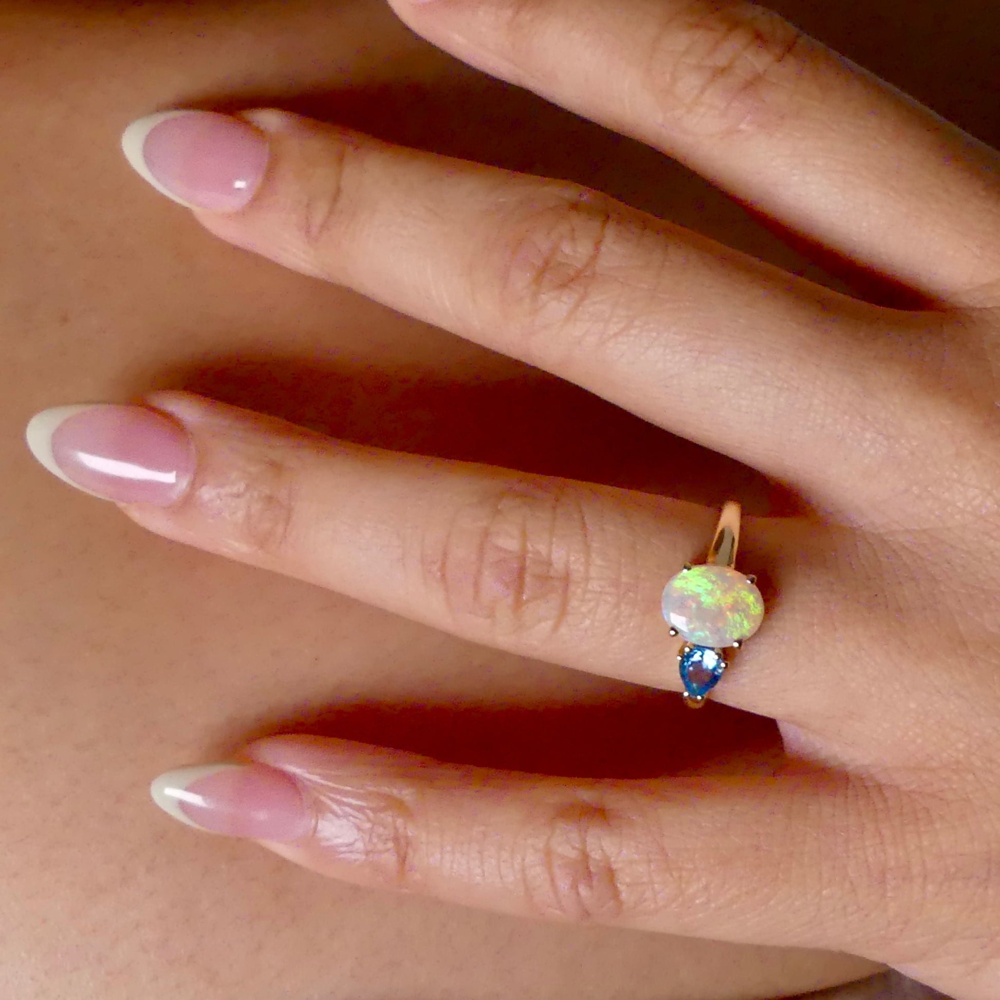 Introducing our stunning 14k Gold Australian Crystal Opal Ring. Ethically sourced from Lightning Ridge Australia, its mesmerizing play-of-color is unlike any other. Each piece is truly one-of-a-kind

Origin- Lightning Ridge Australia

Opal Weight- 1ct Australian Crystal Opal

Setting- 14k Claw Setting

Accent Stone- Swiss Blue Topaz

Ring Size- 6 1/2us.

Handcrafted with precision and passion by Australian Artisans.
