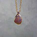Expertly crafted with elegance, our 9k Gold Lightning Ridge Opal Pendant boasts a rare and stunning Lightning Ridge Opal, showcasing vibrant pastel colors.

Origin- Lightning Ridge Australia

Opal Weight- 1.1ct lightning Ridge Opal

Setting- 9K Gold

Accent Stone- Natural Diamond

Chain- 9k Gold cable chain, 45cm in length
