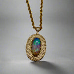 Experience the mesmerizing beauty of this 9k Gold Lightning Ridge Opal Pendant. Crafted with stunning crystal opal from the renowned Lightning Ridge mines, this pendant showcases a stunning array of blue and green hues.

Origin- Lightning Ridge Australia

Opal weight- 0.95ct Lightning Ridge Crystal Opal

Setting- 9K Gold

Chain- 9K gold cable chain, 45cm in length