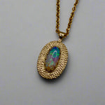 Experience the mesmerizing beauty of this 9k Gold Lightning Ridge Opal Pendant. Crafted with stunning crystal opal from the renowned Lightning Ridge mines, this pendant showcases a stunning array of blue and green hues.

Origin- Lightning Ridge Australia

Opal weight- 0.95ct Lightning Ridge Crystal Opal

Setting- 9K Gold

Chain- 9K gold cable chain, 45cm in length