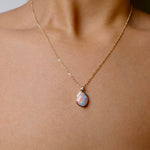 Expertly crafted with elegance, our 9k Gold Lightning Ridge Opal Pendant boasts a rare and stunning Lightning Ridge Opal, showcasing vibrant pastel colors.

Origin- Lightning Ridge Australia

Opal Weight- 1.1ct lightning Ridge Opal

Setting- 9K Gold

Accent Stone- Natural Diamond

Chain- 9k Gold cable chain, 45cm in length
