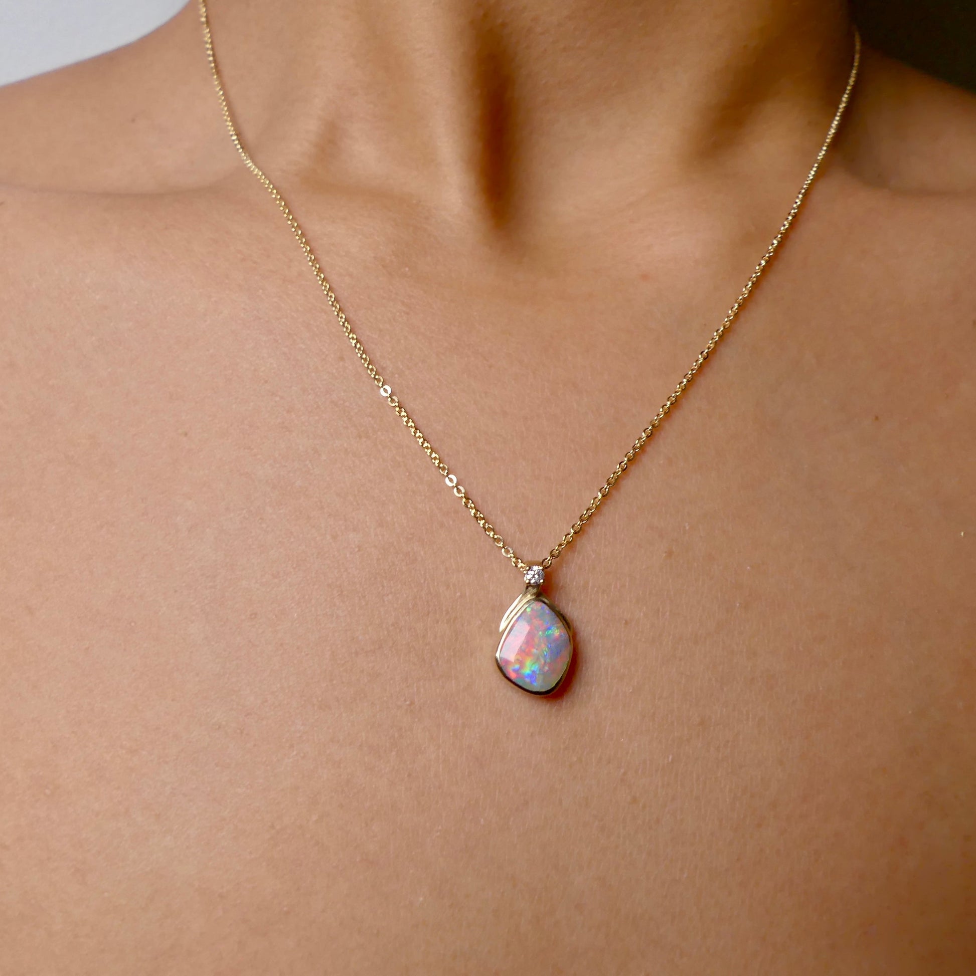 Expertly crafted with elegance, our 9k Gold Lightning Ridge Opal Pendant boasts a rare and stunning Lightning Ridge Opal, showcasing vibrant pastel colors.

Origin- Lightning Ridge Australia

Opal Weight- 1.1ct lightning Ridge Opal

Setting- 9K Gold

Accent Stone- Natural Diamond

Chain- 9k Gold cable chain, 45cm in length

