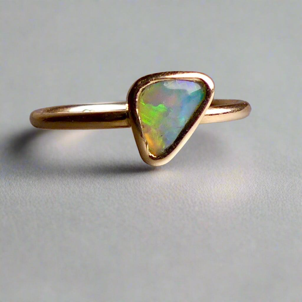 This Elegant 9ct Gold Ring is perfect for any occasion. Made with a stunning Crystal Opal from Lightning Ridge, displaying the full spectrum of colors, making it a unique and eye-catching piece. Its simple and elegant design adds a touch of sophistication to any outfit.

Origin- Lightning Ridge Australia

Opal- Australian Crystal Opal mined in Lightning Ridge Australia

Setting- 9ct solid Gold Bezel set

Size- 6 1/2 us

Designed and Handcrafted by skilled Australian Artisans
