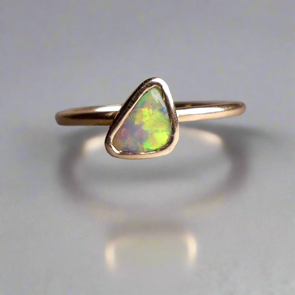 This Elegant 9ct Gold Ring is perfect for any occasion. Made with a stunning Crystal Opal from Lightning Ridge, displaying the full spectrum of colors, making it a unique and eye-catching piece. Its simple and elegant design adds a touch of sophistication to any outfit.

Origin- Lightning Ridge Australia

Opal- Australian Crystal Opal mined in Lightning Ridge Australia

Setting- 9ct solid Gold Bezel set

Size- 6 1/2 us

Designed and Handcrafted by skilled Australian Artisans
