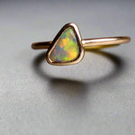 This Elegant 9ct Gold Ring is perfect for any occasion. Made with a stunning Crystal Opal from Lightning Ridge, displaying the full spectrum of colors, making it a unique and eye-catching piece. Its simple and elegant design adds a touch of sophistication to any outfit.

Origin- Lightning Ridge Australia

Opal- Australian Crystal Opal mined in Lightning Ridge Australia

Setting- 9ct solid Gold Bezel set

Size- 6 1/2 us

Designed and Handcrafted by skilled Australian Artisans
