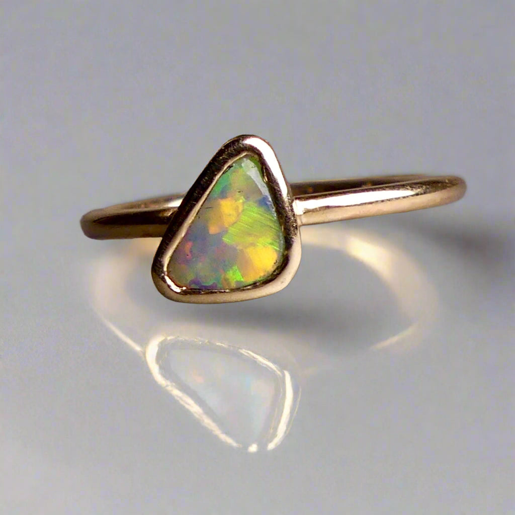 This Elegant 9ct Gold Ring is perfect for any occasion. Made with a stunning Crystal Opal from Lightning Ridge, displaying the full spectrum of colors, making it a unique and eye-catching piece. Its simple and elegant design adds a touch of sophistication to any outfit.

Origin- Lightning Ridge Australia

Opal- Australian Crystal Opal mined in Lightning Ridge Australia

Setting- 9ct solid Gold Bezel set

Size- 6 1/2 us

Designed and Handcrafted by skilled Australian Artisans
