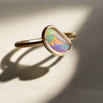 This Elegant 9ct Gold Ring is perfect for any occasion. Made with a stunning Crystal Opal from Lightning Ridge, displaying the full spectrum of colors, making it a unique and eye-catching piece. Its simple and elegant design adds a touch of sophistication to any outfit.

Origin- Lightning Ridge Australia

Opal- Australian Crystal Opal mined in Lightning Ridge Australia

Setting- 9ct solid Gold Bezel set

Size- 6 1/2 us

Designed and Handcrafted by skilled Australian Artisans