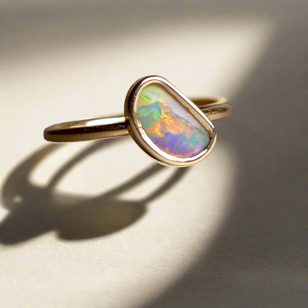 This Elegant 9ct Gold Ring is perfect for any occasion. Made with a stunning Crystal Opal from Lightning Ridge, displaying the full spectrum of colors, making it a unique and eye-catching piece. Its simple and elegant design adds a touch of sophistication to any outfit.

Origin- Lightning Ridge Australia

Opal- Australian Crystal Opal mined in Lightning Ridge Australia

Setting- 9ct solid Gold Bezel set

Size- 6 1/2 us

Designed and Handcrafted by skilled Australian Artisans