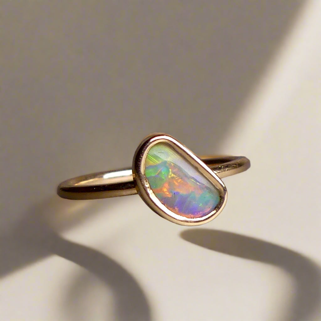 This Elegant 9ct Gold Ring is perfect for any occasion. Made with a stunning Crystal Opal from Lightning Ridge, displaying the full spectrum of colors, making it a unique and eye-catching piece. Its simple and elegant design adds a touch of sophistication to any outfit.

Origin- Lightning Ridge Australia

Opal- Australian Crystal Opal mined in Lightning Ridge Australia

Setting- 9ct solid Gold Bezel set

Size- 6 1/2 us

Designed and Handcrafted by skilled Australian Artisans