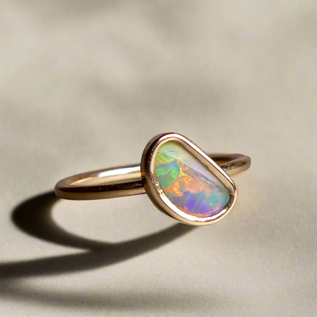 This Elegant 9ct Gold Ring is perfect for any occasion. Made with a stunning Crystal Opal from Lightning Ridge, displaying the full spectrum of colors, making it a unique and eye-catching piece. Its simple and elegant design adds a touch of sophistication to any outfit.

Origin- Lightning Ridge Australia

Opal- Australian Crystal Opal mined in Lightning Ridge Australia

Setting- 9ct solid Gold Bezel set

Size- 6 1/2 us

Designed and Handcrafted by skilled Australian Artisans