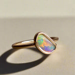 This Elegant 9ct Gold Ring is perfect for any occasion. Made with a stunning Crystal Opal from Lightning Ridge, displaying the full spectrum of colors, making it a unique and eye-catching piece. Its simple and elegant design adds a touch of sophistication to any outfit.

Origin- Lightning Ridge Australia

Opal- Australian Crystal Opal mined in Lightning Ridge Australia

Setting- 9ct solid Gold Bezel set

Size- 6 1/2 us

Designed and Handcrafted by skilled Australian Artisans