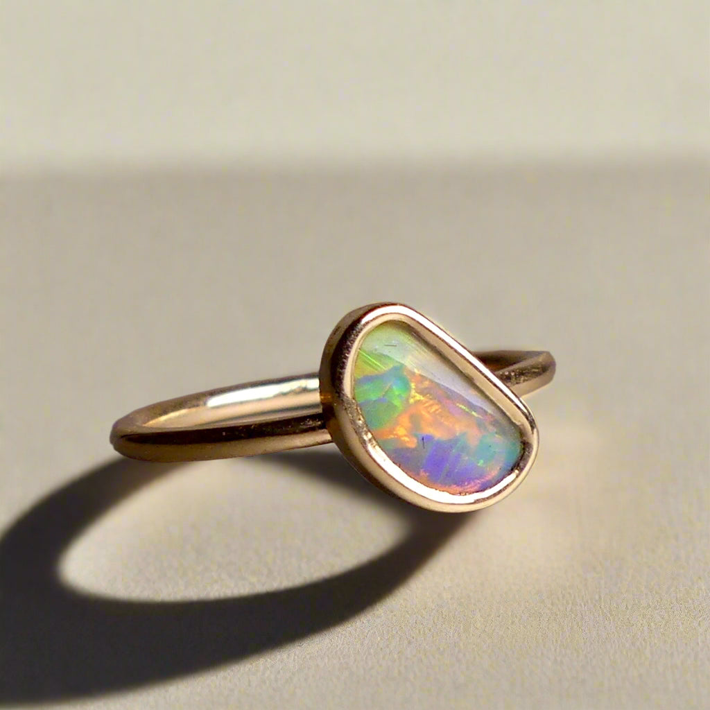 This Elegant 9ct Gold Ring is perfect for any occasion. Made with a stunning Crystal Opal from Lightning Ridge, displaying the full spectrum of colors, making it a unique and eye-catching piece. Its simple and elegant design adds a touch of sophistication to any outfit.

Origin- Lightning Ridge Australia

Opal- Australian Crystal Opal mined in Lightning Ridge Australia

Setting- 9ct solid Gold Bezel set

Size- 6 1/2 us

Designed and Handcrafted by skilled Australian Artisans