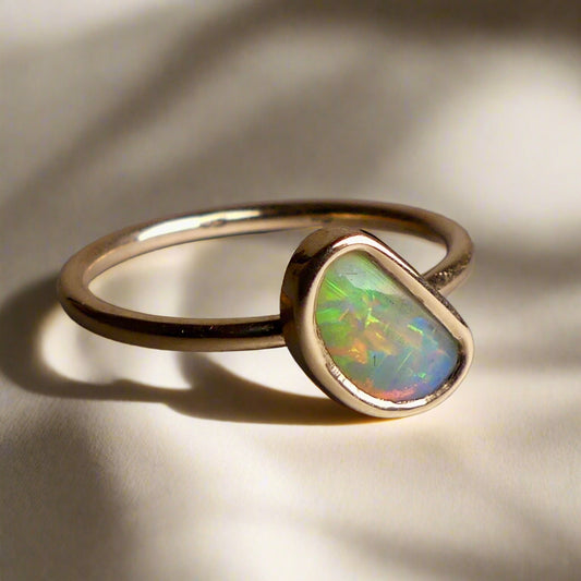 This Elegant 9ct Gold Ring is perfect for any occasion. Made with a stunning Crystal Opal from Lightning Ridge, displaying the full spectrum of colors, making it a unique and eye-catching piece. Its simple and elegant design adds a touch of sophistication to any outfit.

Origin- Lightning Ridge Australia

Opal- Australian Crystal Opal mined in Lightning Ridge Australia

Setting- 9ct solid Gold Bezel set

Size- 6 1/2 us

Designed and Handcrafted by skilled Australian Artisans