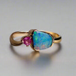 Indulge in luxury with our Elegant 9k Gold Australian Boulder Opal Ring. This opulent piece displays a mesmerizing array of colors, making it a true statement of elegance. Handcrafted with the finest materials, this ring exudes sophistication and exclusivity. Elevate your style and add a touch of opulence to any outfit.

Opal- 2ct Australian Boulder Opal

Origin- Queensland Australia

Setting- 9k Gold Bezel Set

Accent Stone- Pink Tourmaline

Size- 7 1/2