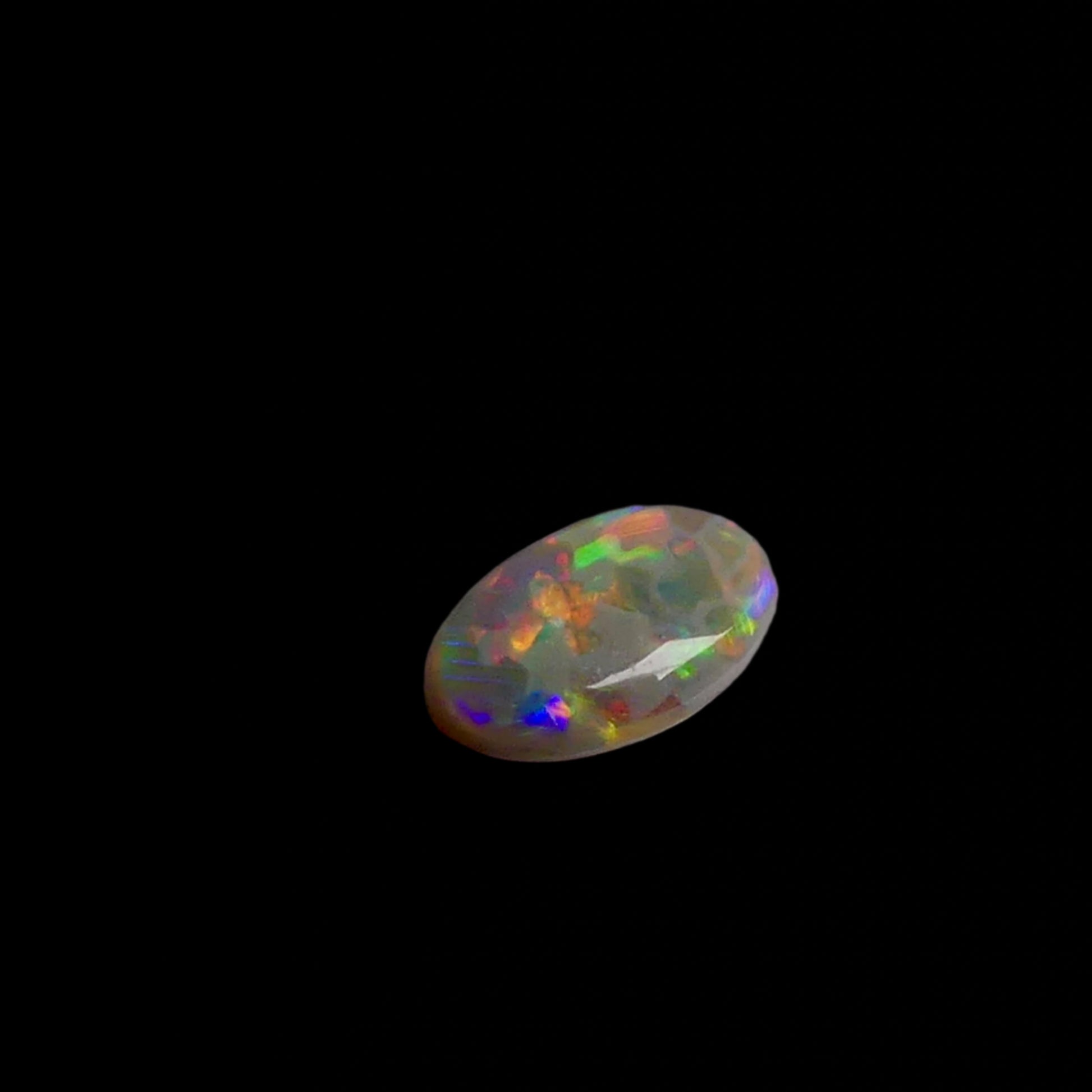 This 1.1ct Lightning Ridge Opal exhibits the distinctive pastel color spectrum that makes these Australian gems highly coveted. Expertly cut to enhance its natural play-of-light, this specimen displays delicate color transitions across its surface. The characteristic pastel palette demonstrates the superior quality typical of authentic Lightning Ridge material.
