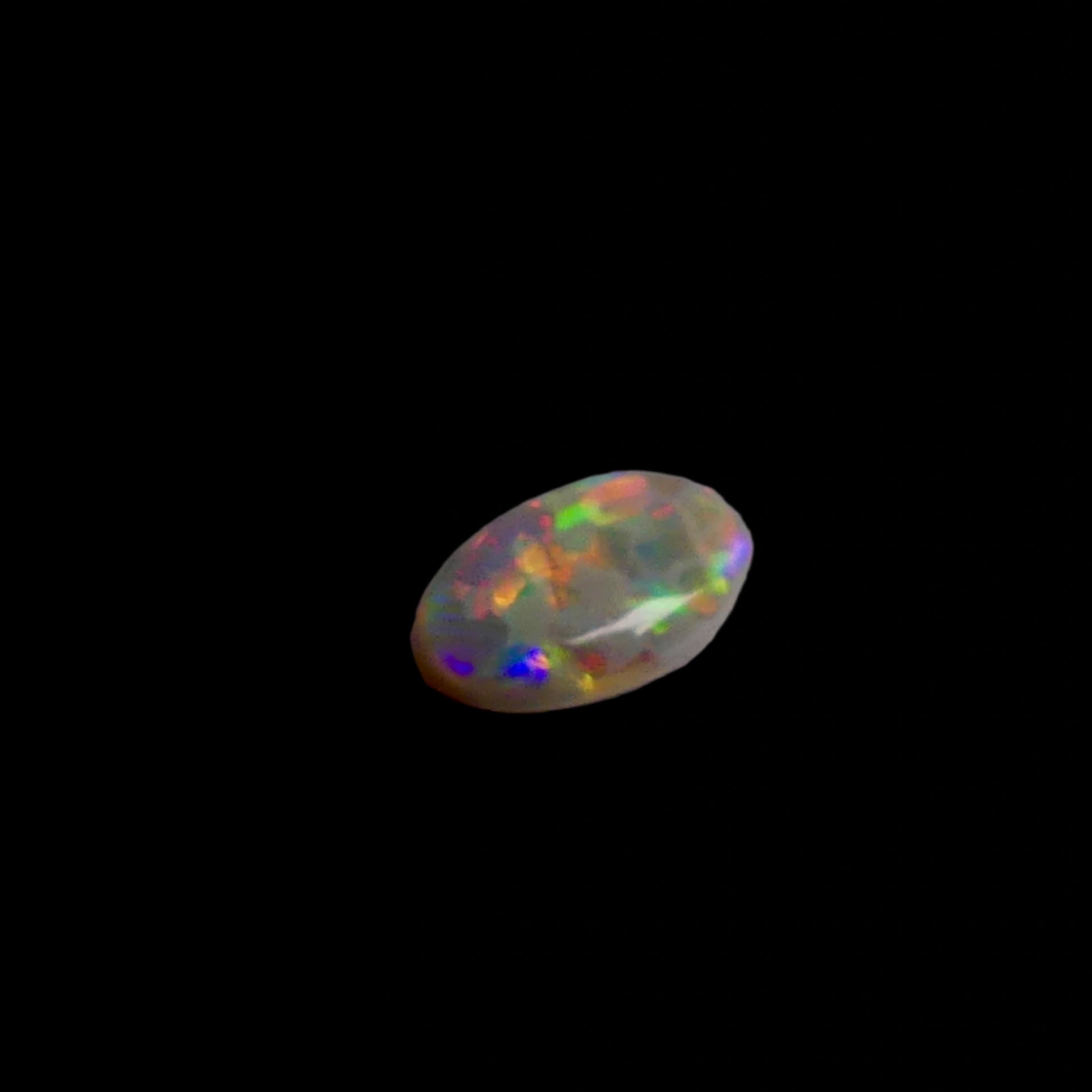 This 1.1ct Lightning Ridge Opal exhibits the distinctive pastel color spectrum that makes these Australian gems highly coveted. Expertly cut to enhance its natural play-of-light, this specimen displays delicate color transitions across its surface. The characteristic pastel palette demonstrates the superior quality typical of authentic Lightning Ridge material.

