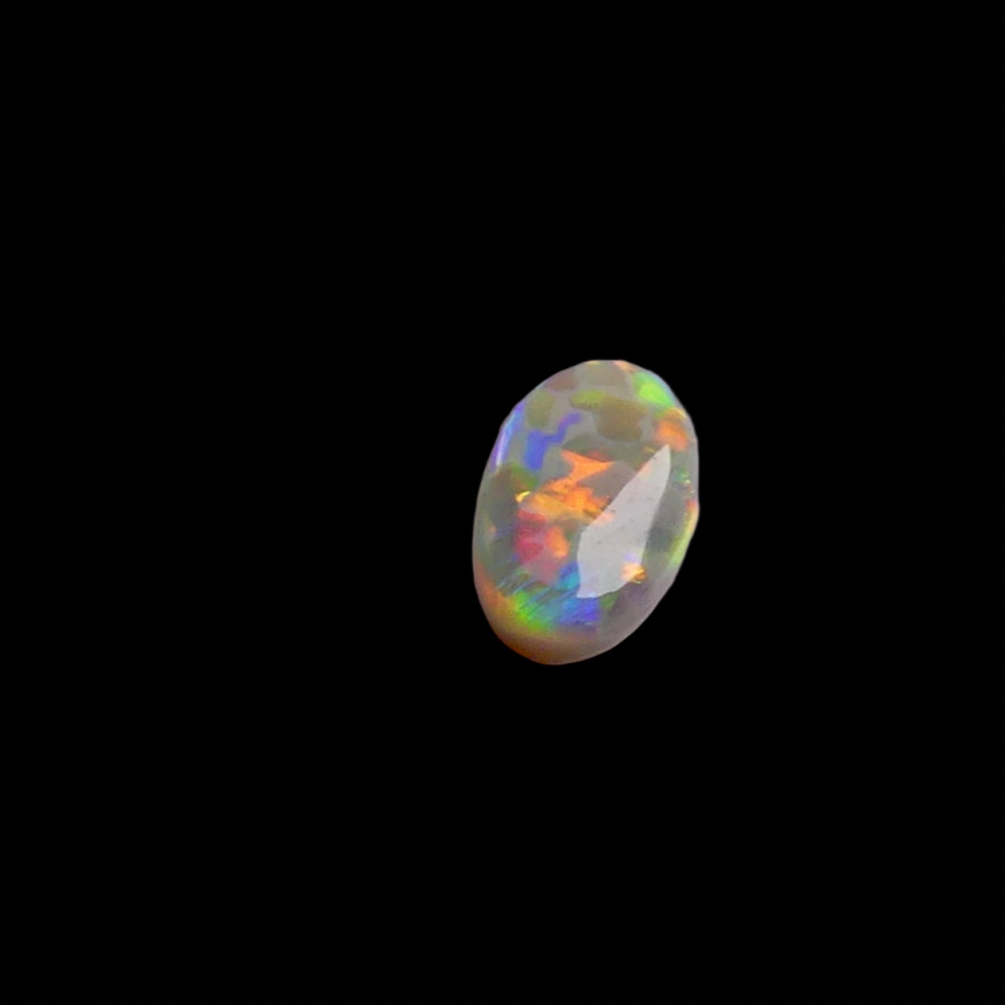 This 1.1ct Lightning Ridge Opal exhibits the distinctive pastel color spectrum that makes these Australian gems highly coveted. Expertly cut to enhance its natural play-of-light, this specimen displays delicate color transitions across its surface. The characteristic pastel palette demonstrates the superior quality typical of authentic Lightning Ridge material.
