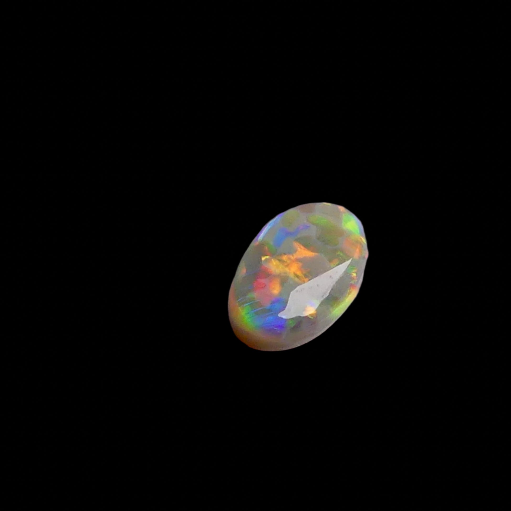 This 1.1ct Lightning Ridge Opal exhibits the distinctive pastel color spectrum that makes these Australian gems highly coveted. Expertly cut to enhance its natural play-of-light, this specimen displays delicate color transitions across its surface. The characteristic pastel palette demonstrates the superior quality typical of authentic Lightning Ridge material.
