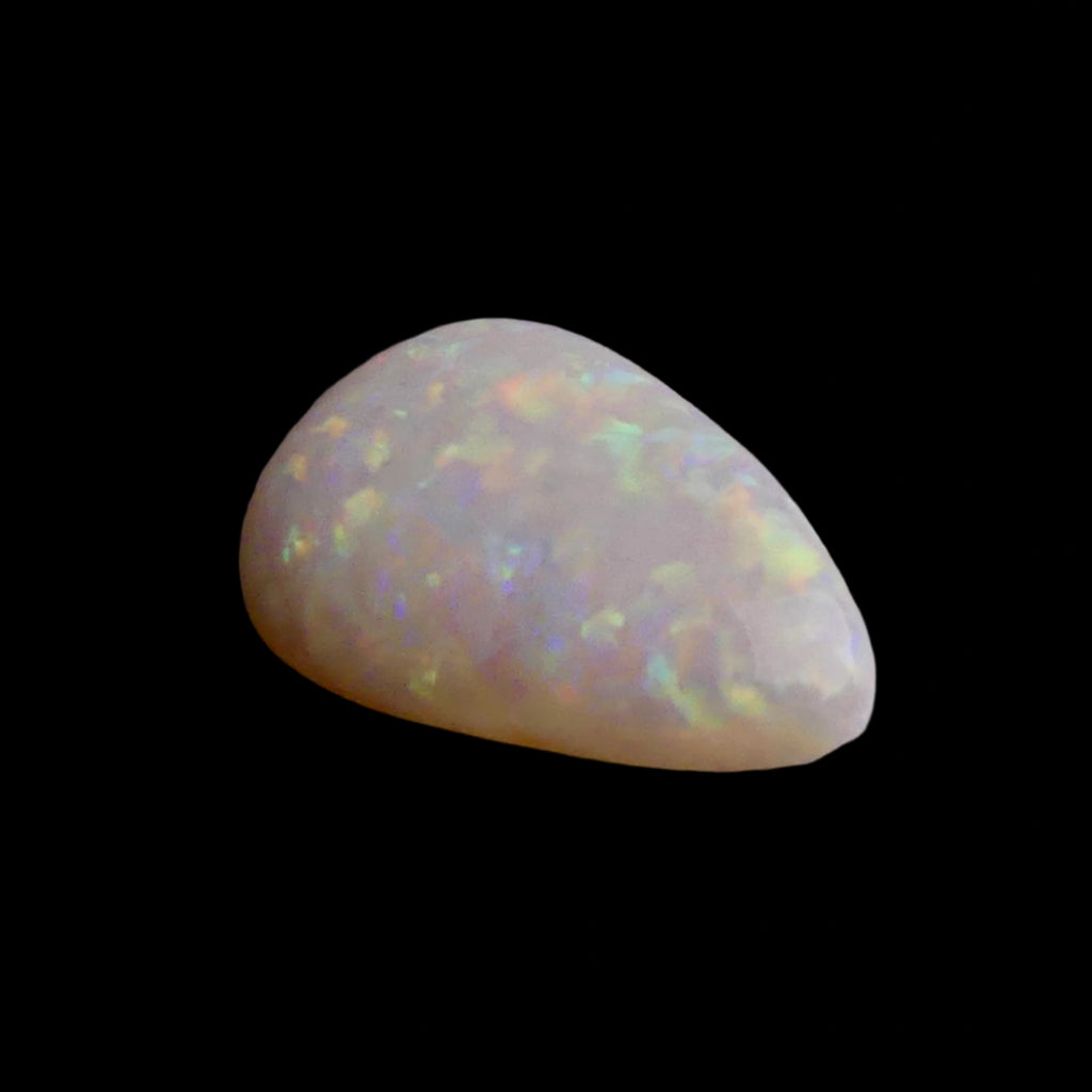 This magnificent 3.8ct Coober Pedy Australian Opal showcases nature's artistry at its finest. Marvel at the breathtaking play of colors as this premium gemstone displays the complete spectrum from fiery reds to cool blues. Mined from Australia's renowned Coober Pedy region.