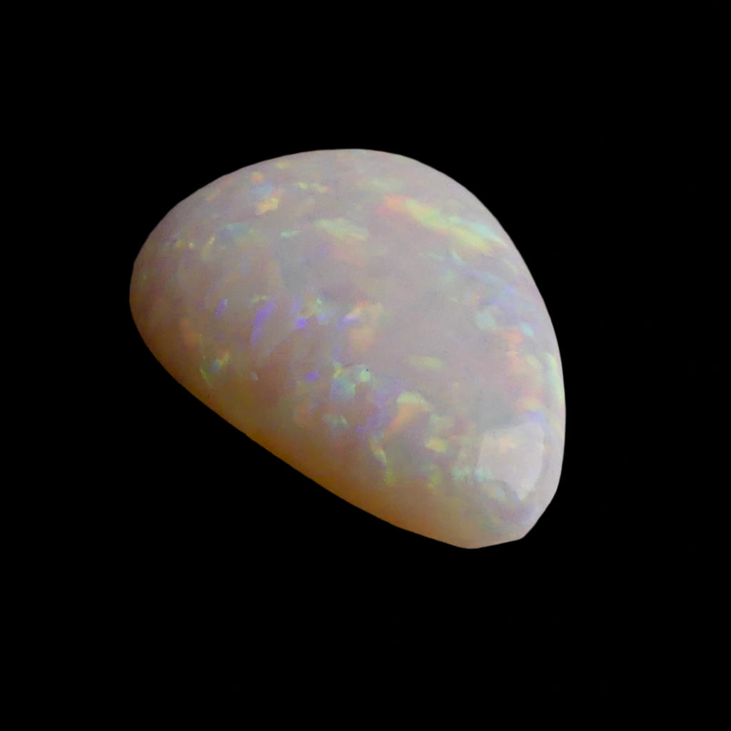 This magnificent 3.8ct Coober Pedy Australian Opal showcases nature's artistry at its finest. Marvel at the breathtaking play of colors as this premium gemstone displays the complete spectrum from fiery reds to cool blues. Mined from Australia's renowned Coober Pedy region.