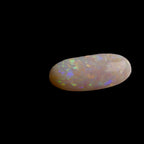 This extraordinary 6.4ct Coober Pedy Australian Opal showcases the legendary fire and brilliance that makes these gems so coveted worldwide. Mined from the renowned opal fields of South Australia, this unique specimen displays a mesmerizing play of colors that will captivate all who see it
