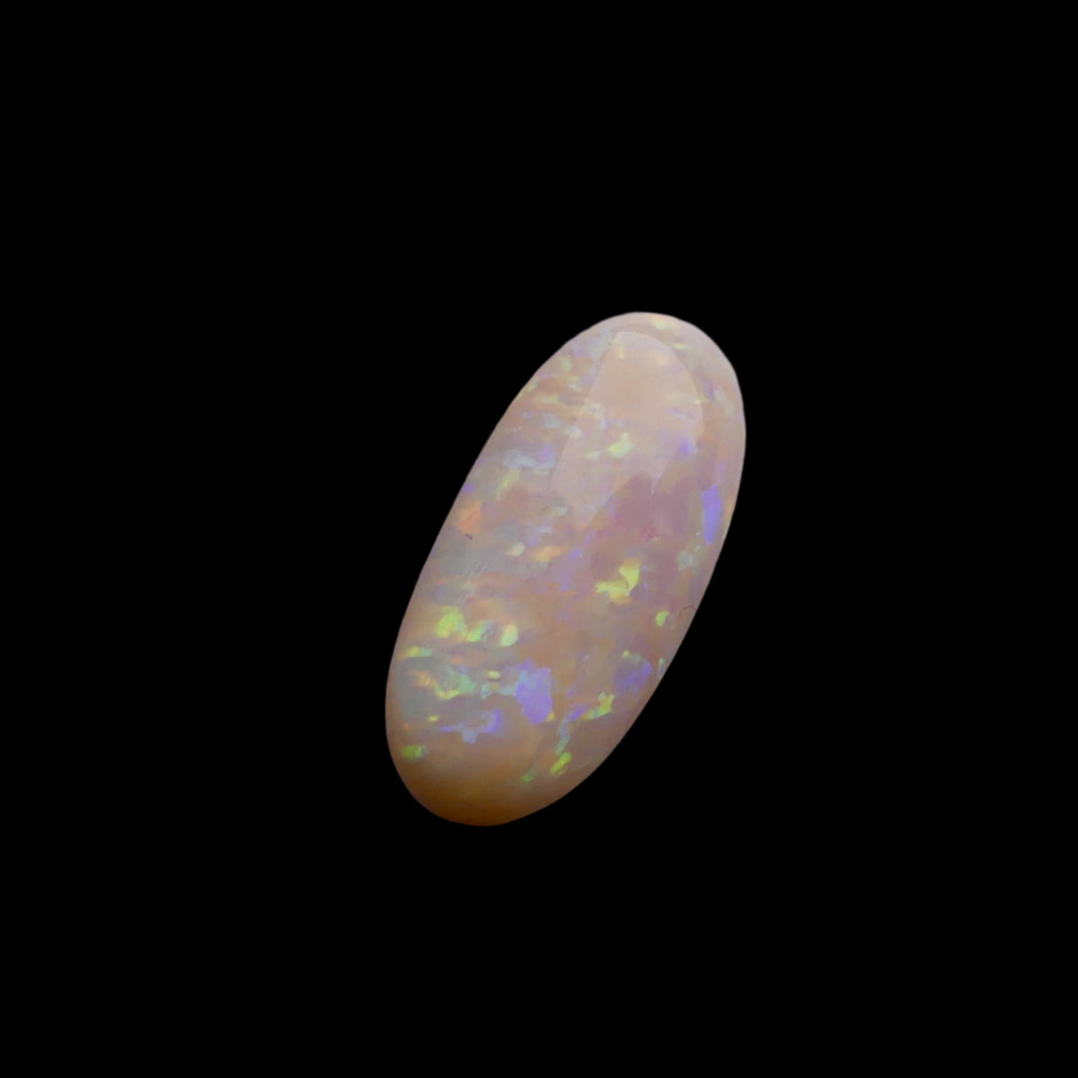 This extraordinary 6.4ct Coober Pedy Australian Opal showcases the legendary fire and brilliance that makes these gems so coveted worldwide. Mined from the renowned opal fields of South Australia, this unique specimen displays a mesmerizing play of colors that will captivate all who see it
