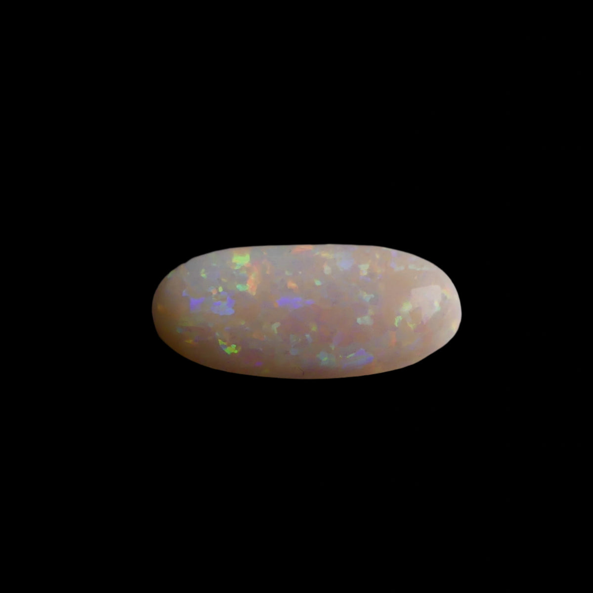 This extraordinary 6.4ct Coober Pedy Australian Opal showcases the legendary fire and brilliance that makes these gems so coveted worldwide. Mined from the renowned opal fields of South Australia, this unique specimen displays a mesmerizing play of colors that will captivate all who see it
