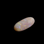 This extraordinary 6.4ct Coober Pedy Australian Opal showcases the legendary fire and brilliance that makes these gems so coveted worldwide. Mined from the renowned opal fields of South Australia, this unique specimen displays a mesmerizing play of colors that will captivate all who see it
