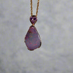 This exquisite 9k gold pendant features a genuine Australian Boulder Opal, showcasing vivid pink and green hues that captivate the eye. Expertly crafted to highlight the opal’s natural brilliance, this piece combines durability with elegant design, making it a timeless addition to any fine jewelry collection.